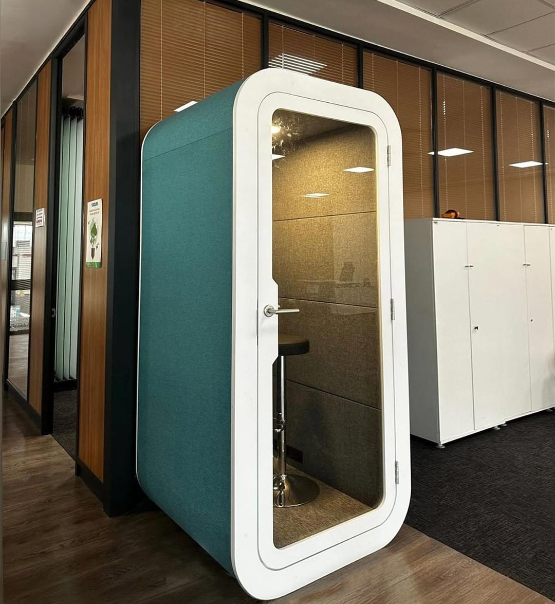 Teal phone booth with white frame
