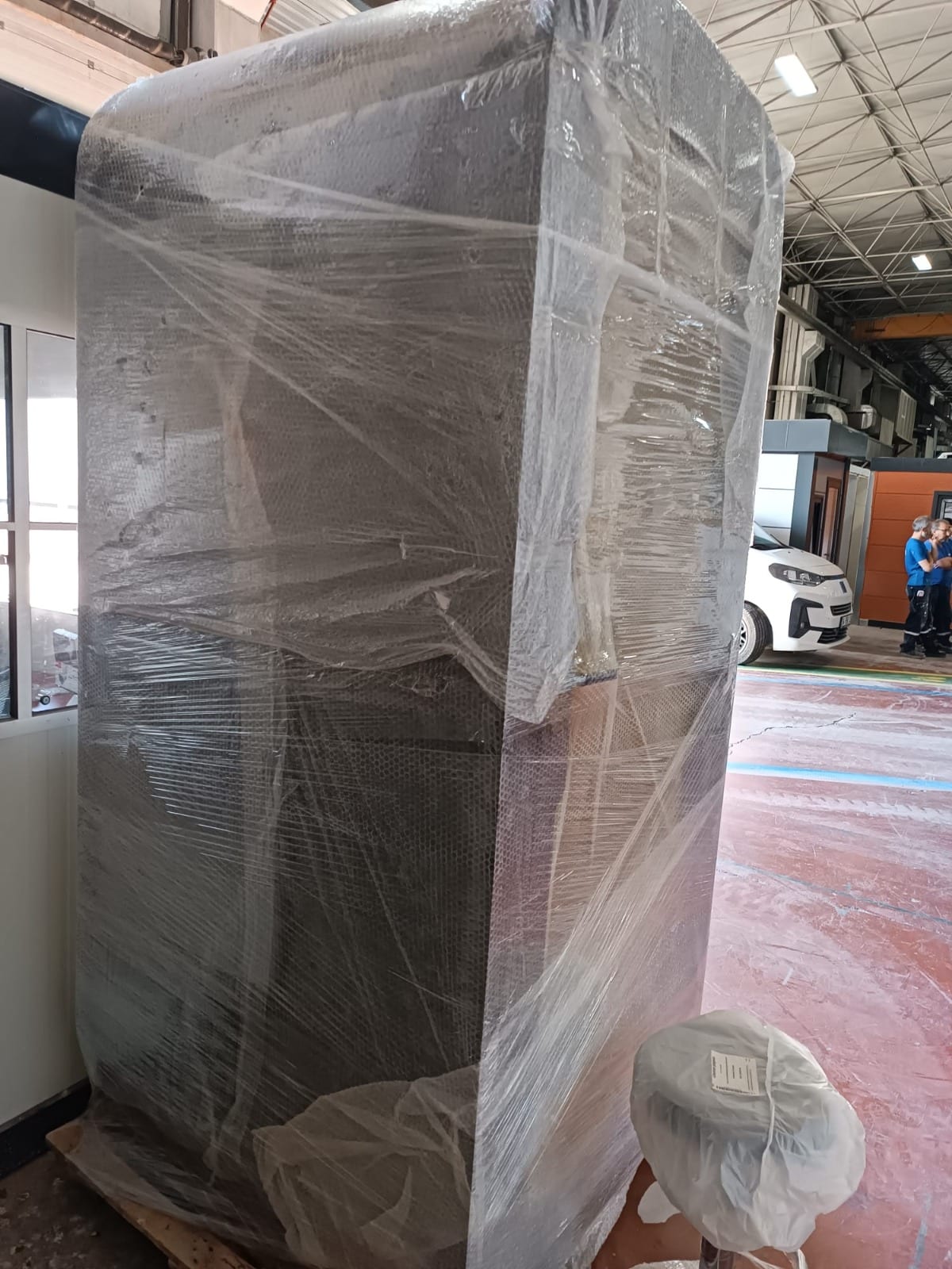 Phone booth wrapped on a pallet in the warehouse, ready for delivery